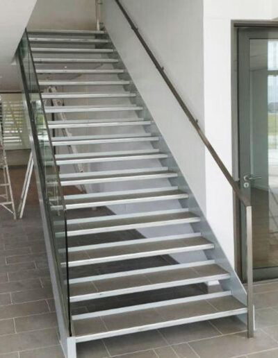Stainless steel staircase with glass